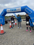 Yiannis grasps his award with gloved hands in what looks like chilly and character-building weather
