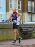 Mike Denson battles the weather